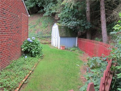 entrance on left side of house thru red fence towards exterior yard