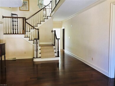 Staircase to 2nd floor and lounge area