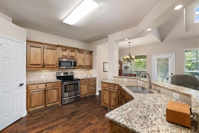 Gourmet kitchen with granite counter tops and unde
