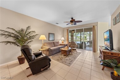 Living room featuring light tile patterned floors,