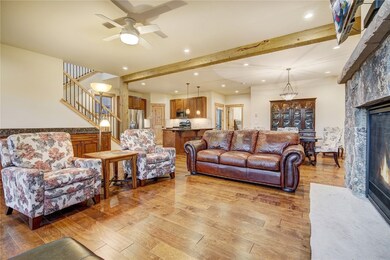 Gleaming hardwood floors flow throughout