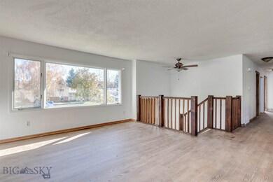 Upstairs Living Room And Stair Railing to Downstai