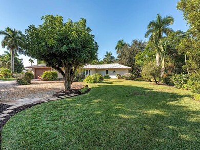 Large well-landscaped lot has ample parking in the
