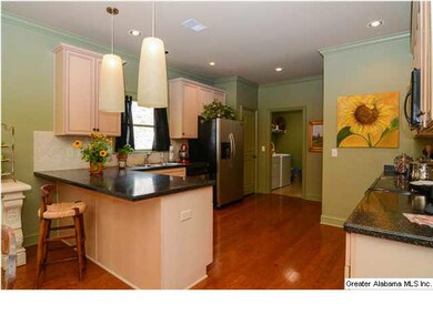 Large open kitchen with solid surface countertops.