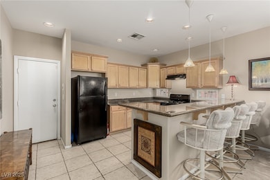 Kitchen featuring granite counters and breakfast b
