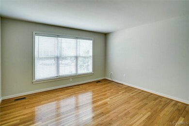 First floor primary with hardwood floors and great