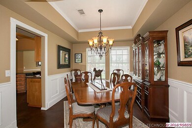 Dramatic formal dining, lots of light, wainscoting