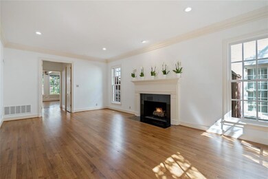 The expansive living room features symmetrically p