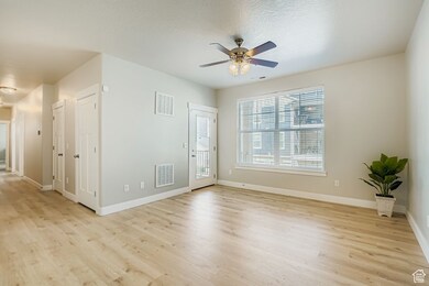 New wood laminate flooring and entrance to covered deck.