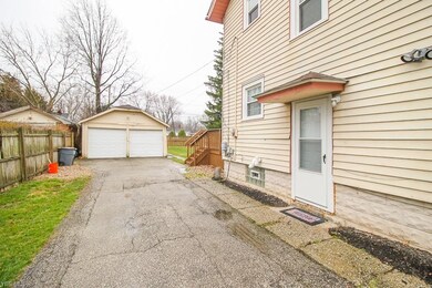 Two car garage with paved driveway.