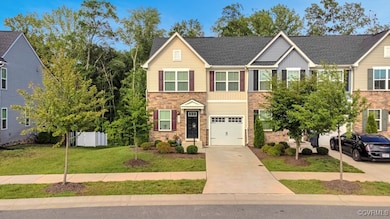 Traditional-style house with concrete driveway, st