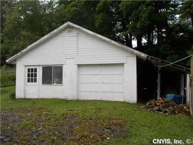 Garage. Right side -wood and other covered storage