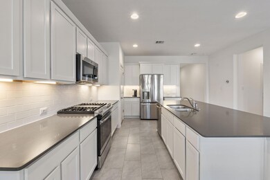 Kitchen featuring a sink, appliances with stainle