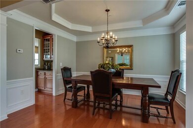 Formal dining features tray ceiling and butlers pantry