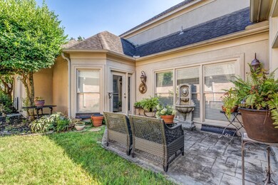 Back of house with a lawn and a patio area