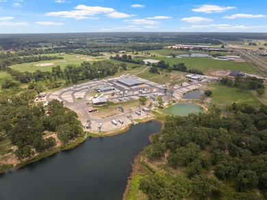 Aerial overview of property's location with a large body of water