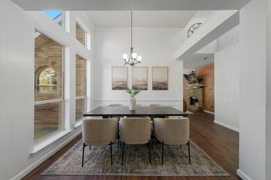 Dining room centered in front wall of windows for lots of natural light.