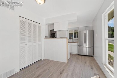 Dining area has wood laminate floor