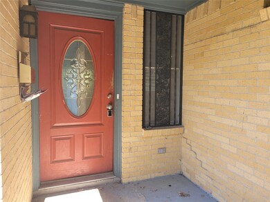 View of exterior entry with covered porch