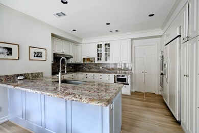 This gourmet kitchen is complete with professional appliances. The stunning countertops bring warmth to the space while the magnificent hardwoods flow seamlessly throughout.