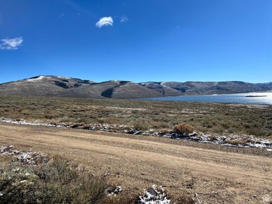 View of mountain backdrop with a nearby body of water