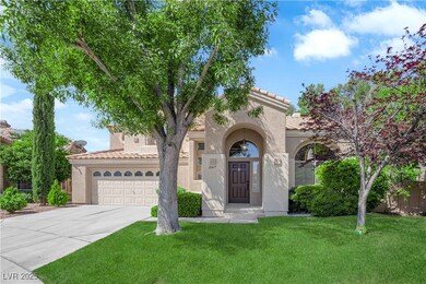 Mediterranean / spanish house with a tiled roof, an attached garage, concrete driveway, stucco siding, and a front yard