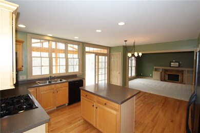 Open and airy kitchen, maple cabinetry, gleaming h