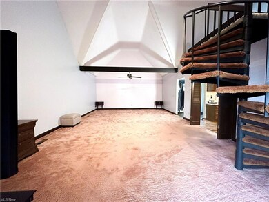 Living/ dining room with vaulted ceiling