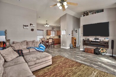 The living room is open to the dining room in this