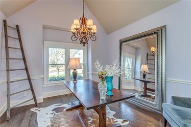 Architectural angles abound in this Formal Room w/Vaulted ceiling, Indented window feature, Large entrance from the Foyer & 8 inch base w/chair molding accents.  The chandelier is an elaborate wrought iron 5 light upgrade...