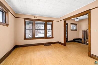 Unfurnished room with light hardwood / wood-style 