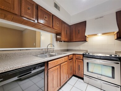 The kitchen has a pass through and the stainless s