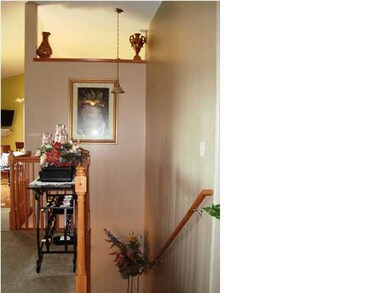 Going down offers an open banister. Again, notice 