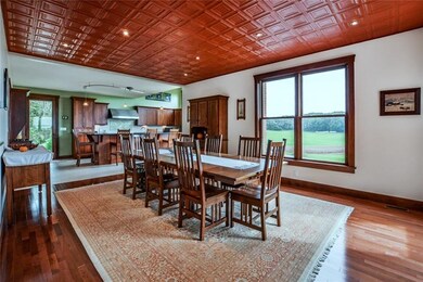 Dining room with hard wood floors and tin ceiling