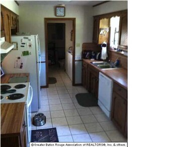 Big kitchen with lots of cabinets and counter spac