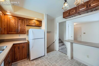 Kitchen featuring white fridge