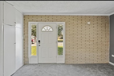 Step into unit B. This unique studio has a brick accent wall.