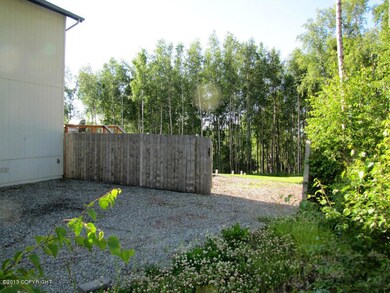 Access gate to back yard via RV pad.