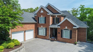 The 2 car oversized garage is accessed from the front parking court and has a back door to the side yard.