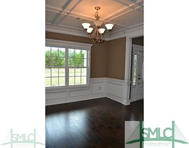 Dining Room. Separate dining room with coffered ce