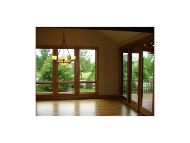 Spacious dining area with vaulted ceiling has grea