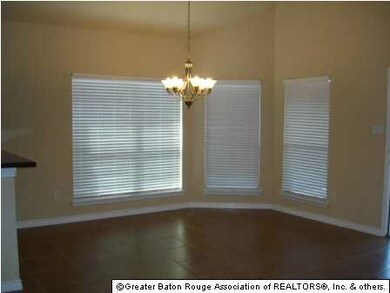 sunny breakfast area with views of screened porch 