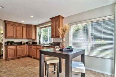 Partial view of the kitchen and breakfast nook. 