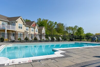 Green Wood community pool with large pool deck