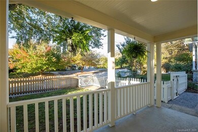 Front porch with walkway to sidewalk gate and gate