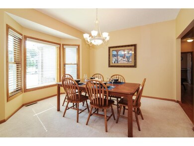 The formal dining area has a bay window and is lar