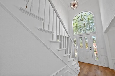 Stairway with ornamental molding and wood-type flo