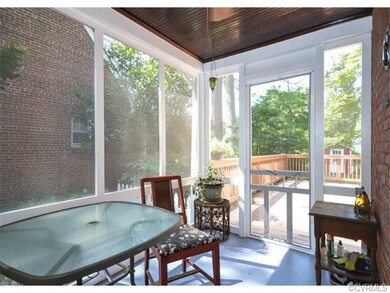 The screen porch is located off the living room, h