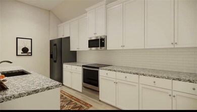 Kitchen featuring tasteful backsplash, stainless s