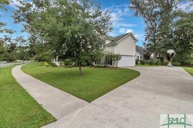 Side View showing the long driveway to the 2 car g